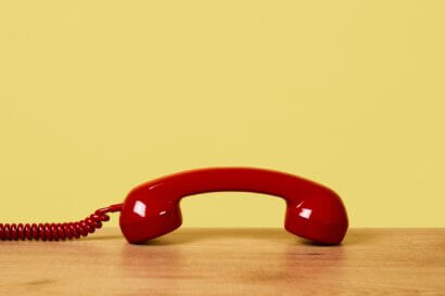 Telephone with yellow background