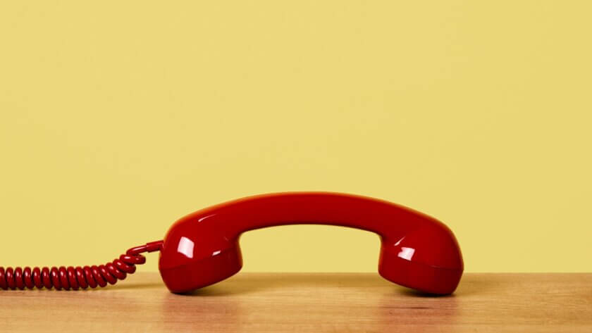 Telephone with yellow background