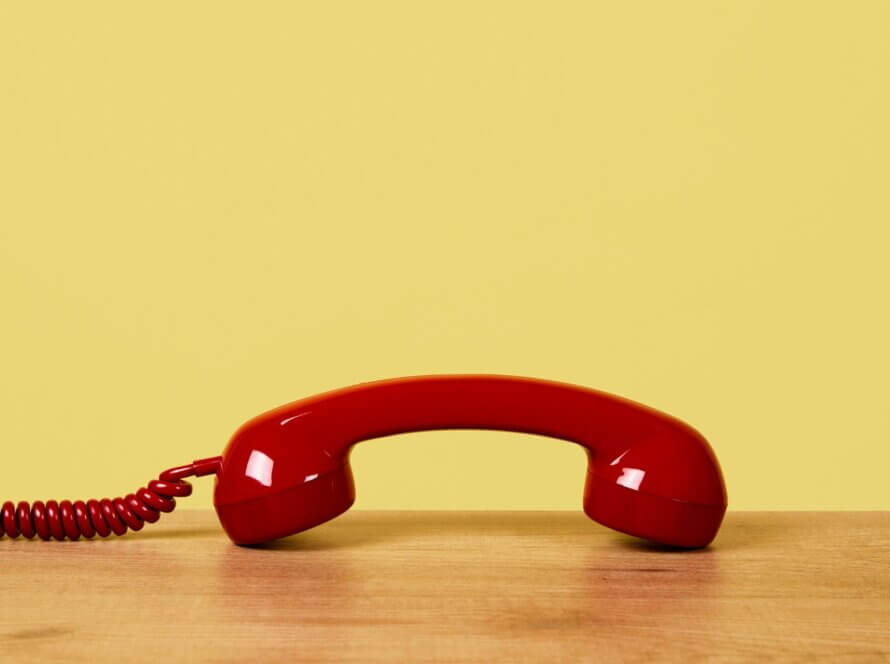 Telephone with yellow background