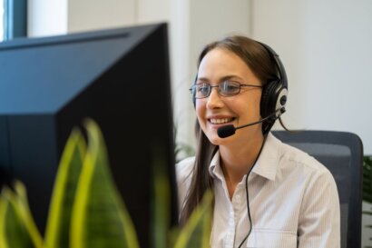 legal intake specialist taking calls in front of a computer